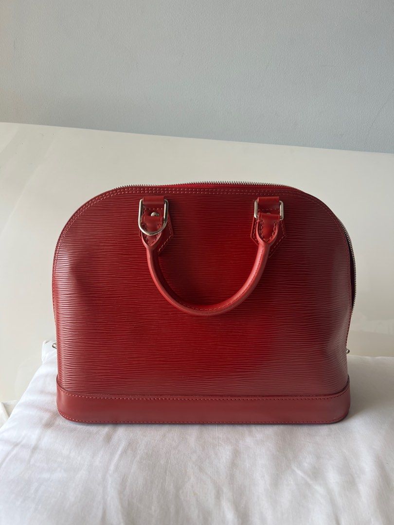 Alma PM red epi (Category: Luxury Bags & Wallets) located in Las Pinas. Submitted by odee25 (Listing ID 1399452807, Image 1). Description: in perfect condition. with dustbag .