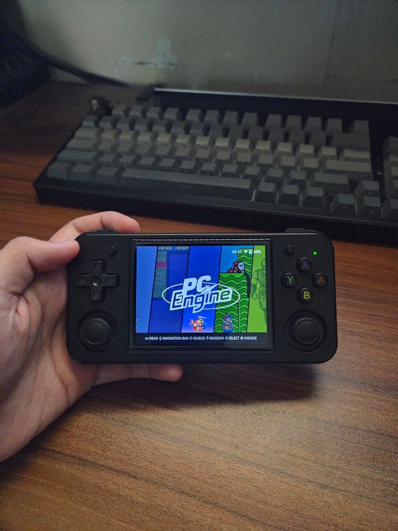 Anbernic RG35XX H Handheld Console (Category: Others) located in Tarlac. Submitted by zyrus.matthew (Listing ID 1399472458, Image 1). Description: Anbernic RG35XX handheld console Sleek black design Features a screen and gameplay buttons Preloaded with various games Includes two MicroSD cards: 16GB (boot) and 128GB (roms) Installed with Knulli Gladiator Negotiable for sure buyer Includes box.
