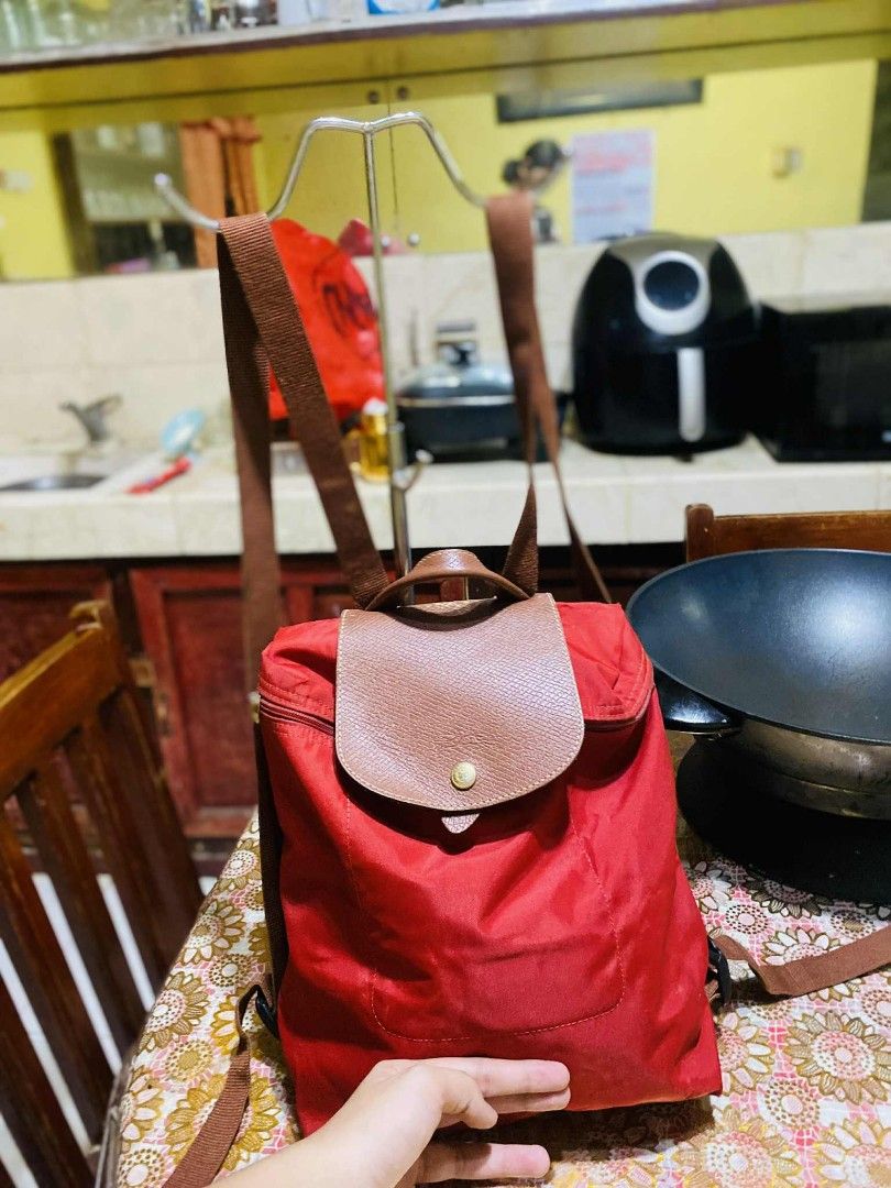 Authentic Longchamp red backpack (Category: Luxury Bags & Wallets) located in San Isidro, Davao Oriental. Submitted by ranofrehets (Listing ID 1399589117, Image 1). Description: authentic Longchamp red P1, 000 SHIPPED Sign of usage MALINIS LOOB NO STAIN.