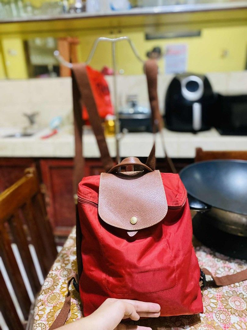 Authentic Longchamp red backpack (Category: Luxury Bags & Wallets) located in San Isidro, Davao Oriental. Submitted by ranofrehets (Listing ID 1399589117, Image 2). Description: authentic Longchamp red P1, 000 SHIPPED Sign of usage MALINIS LOOB NO STAIN.