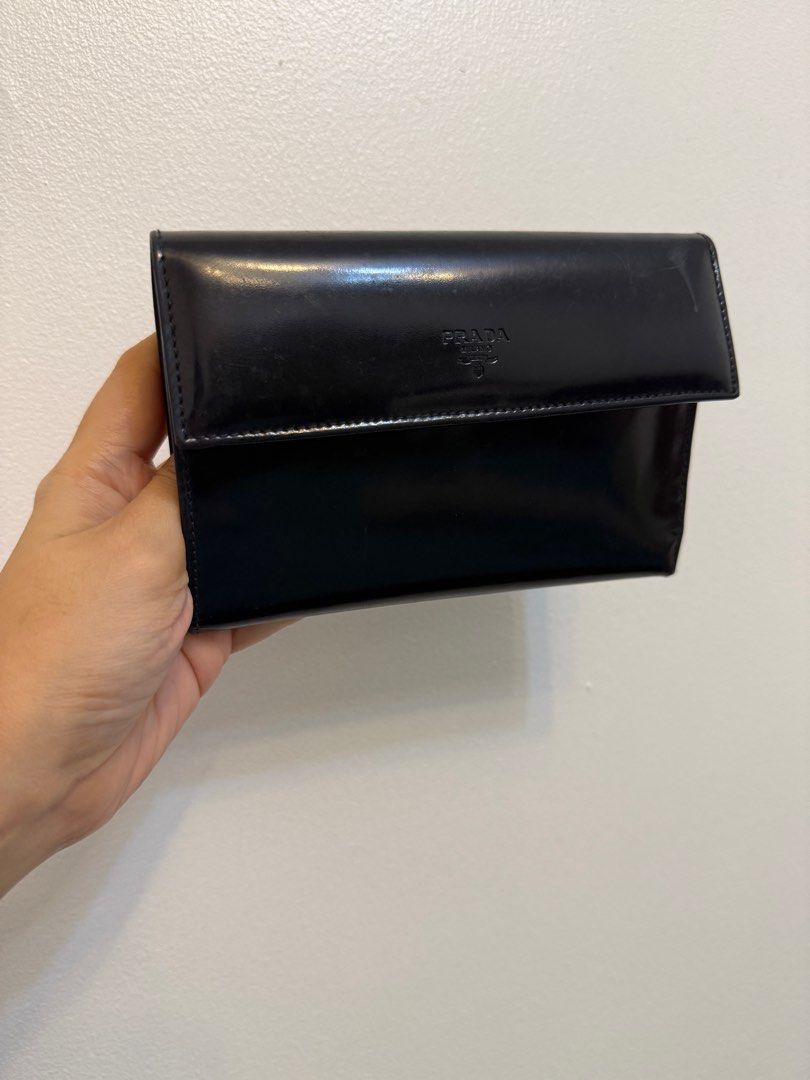 Authentic PRADA Trifold Wallet (Category: Luxury Bags & Wallets) located in Antipolo. Submitted by pinkescee (Listing ID 1399523437, Image 1). Description: Preloved simple and lowley prada wallet Trifold Great to use when travelling. Has a lot of pockets and the bill pocket is suitable for Yen or USD. No damage on corners With usual hairline scratches due to usage No smell. No peeling No inclusions Guaranteed authentic.