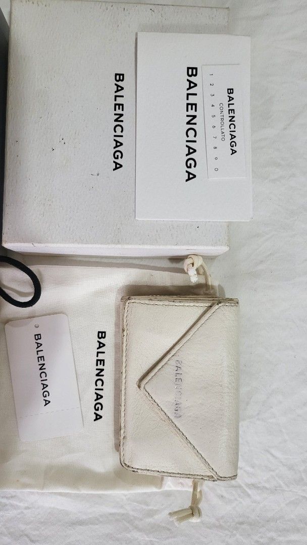 Bundle Balenciaga Envelope Wallet (Category: Luxury Bags & Wallets) located in Quezon City. Submitted by bonching (Listing ID 1399509839, Image 2). Description: - Authentic Balenciaga Trifold wallet - Available in white and yellow - Includes original box, dust bag, and cards - Compact design with snap closure - Comes with all original packaging and accessories - Perfect for everyday use 3800 each.