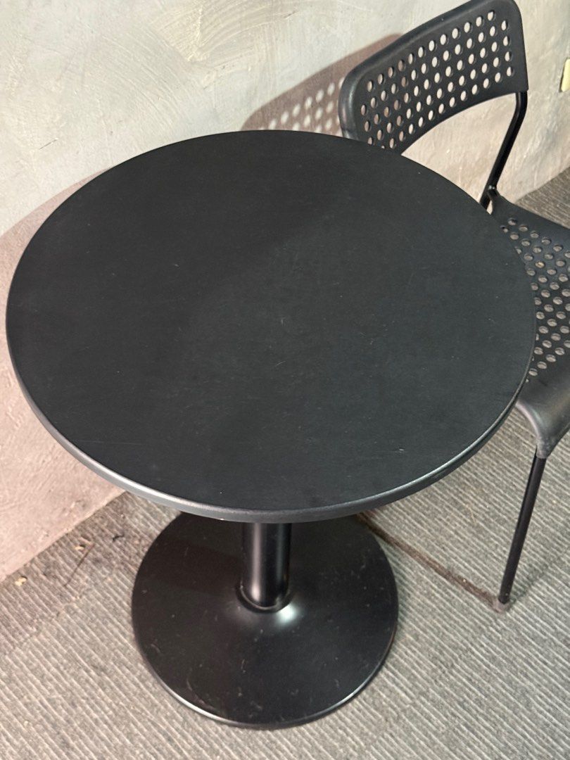 Black Round Table and Chair Set (Category: Tables & Sets) located in Paranaque City. Submitted by mrs_thrifty (Listing ID 1399506917, Image 3). Description: - Black round table with pedestal base. - Matching black chair with perforated backrest. - Modern and simple design. - Ideal for small spaces or cafe-style setup. Tulip table - 750 Ikea chair - 350 Slightly negotiable.