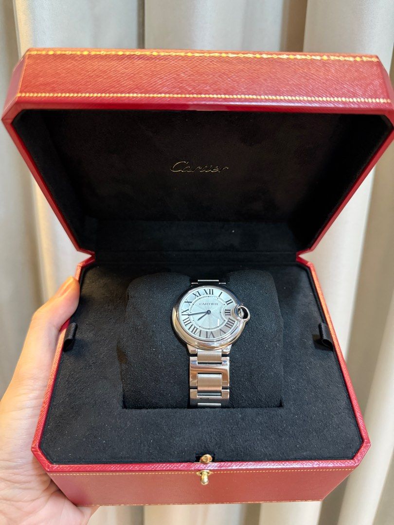 Cartier Ballon Bleu 36mm (Category: Luxury Watches) located in Pasig City. Submitted by simplydadar (Listing ID 1399568559, Image 2). Description: Authentic Cartier Ballon Bleu 36mm - Silver dial with Roman numeral hour markers - Stainless steel bracelet - Includes original box and papers - Comes with extra links Note: Registered in Cartier Website .