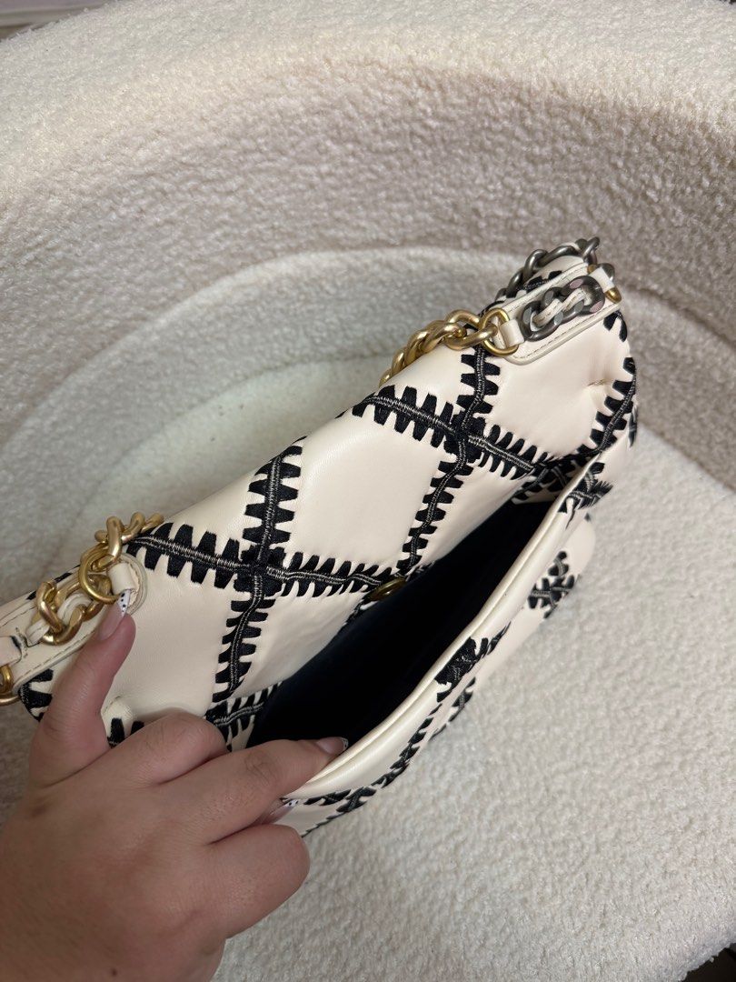 Chanel 19 Flap Bag (Category: Luxury Bags & Wallets) located in Manila. Submitted by blairserena (Listing ID 1399551715, Image 3). Description: - Chanel 19 Flap Bag - Black and white stitched design - Mixed gold and silver chain strap - Black interior - Classic Chanel logo - Medium size.