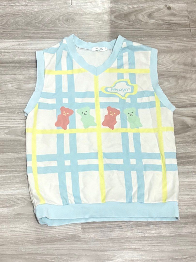 Ding Loving Bear Print Vest (Category: Vests) located in Manila. Submitted by chael_156 (Listing ID 1399552117, Image 1). Description: - Adorable vest with a playful bear print. - Unique plaid design. - V-neck style with light blue trim. - Brand: "Ding Loving" - Size: M - Comfortable fit. - Suitable for various occasions..