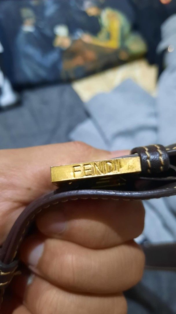 Fendi Shoulder Bag (Category: Luxury Bags & Wallets) located in Narvacan. Submitted by thrift_look (Listing ID 1399568122, Image 2). Description: -Fendi shoulder bag - Iconic FF logo pattern - Brown leather strap and accents - Gold-toned Fendi buckle - Interior zippered pocket with Fendi logo zipper pull - Light brown interior lining..
