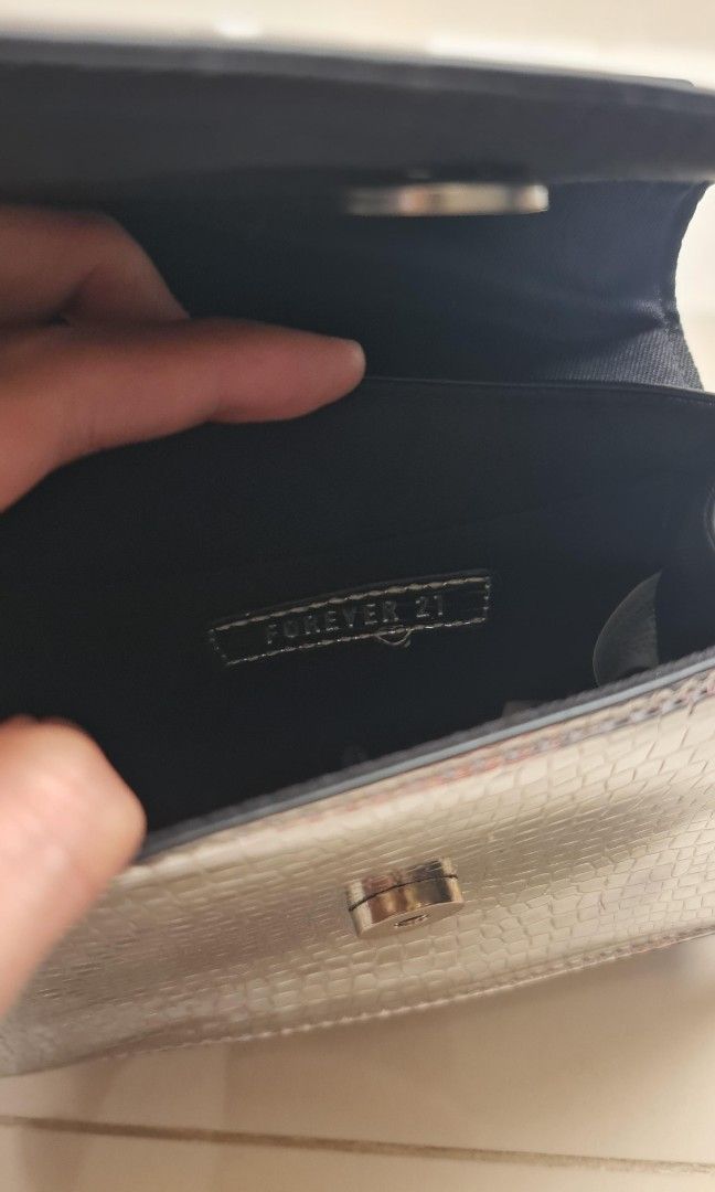 Forever 21 Silver Asymetric Party Bag (Category: Purses & Pouches) located in Pasig City. Submitted by dayarama (Listing ID 1399591838, Image 2). Description: Used only once.