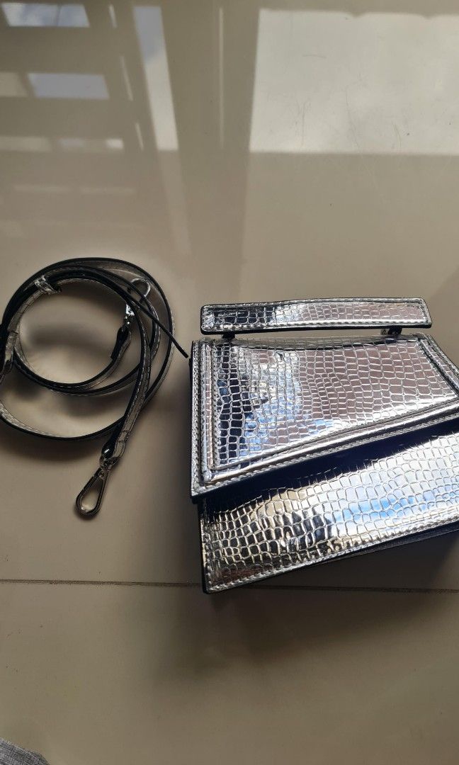 Forever 21 Silver Asymetric Party Bag (Category: Purses & Pouches) located in Pasig City. Submitted by dayarama (Listing ID 1399591838, Image 3). Description: Used only once.