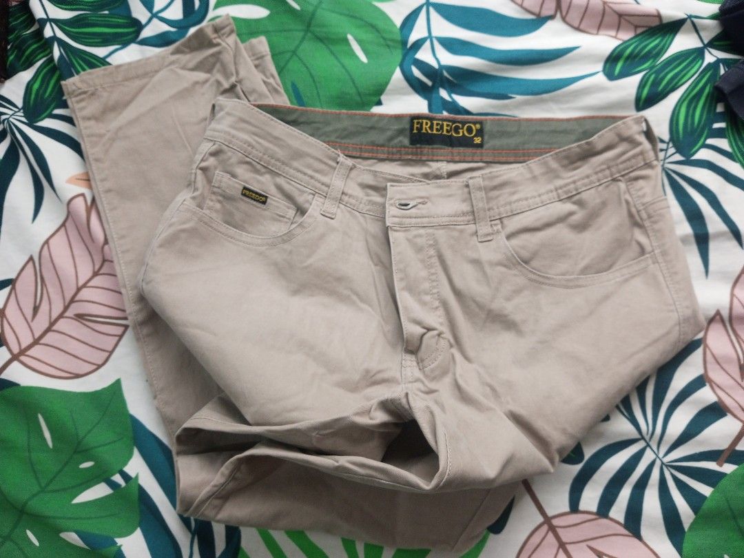 Freego Khaki Pants (Category: Jeans) located in Porac. Submitted by themightythrift (Listing ID 1399532378, Image 3). Description: - Freego Khaki Pants - Size: 32 - Button and zipper closure - Front and back pockets - Visible Freego tag - Classic khaki color.