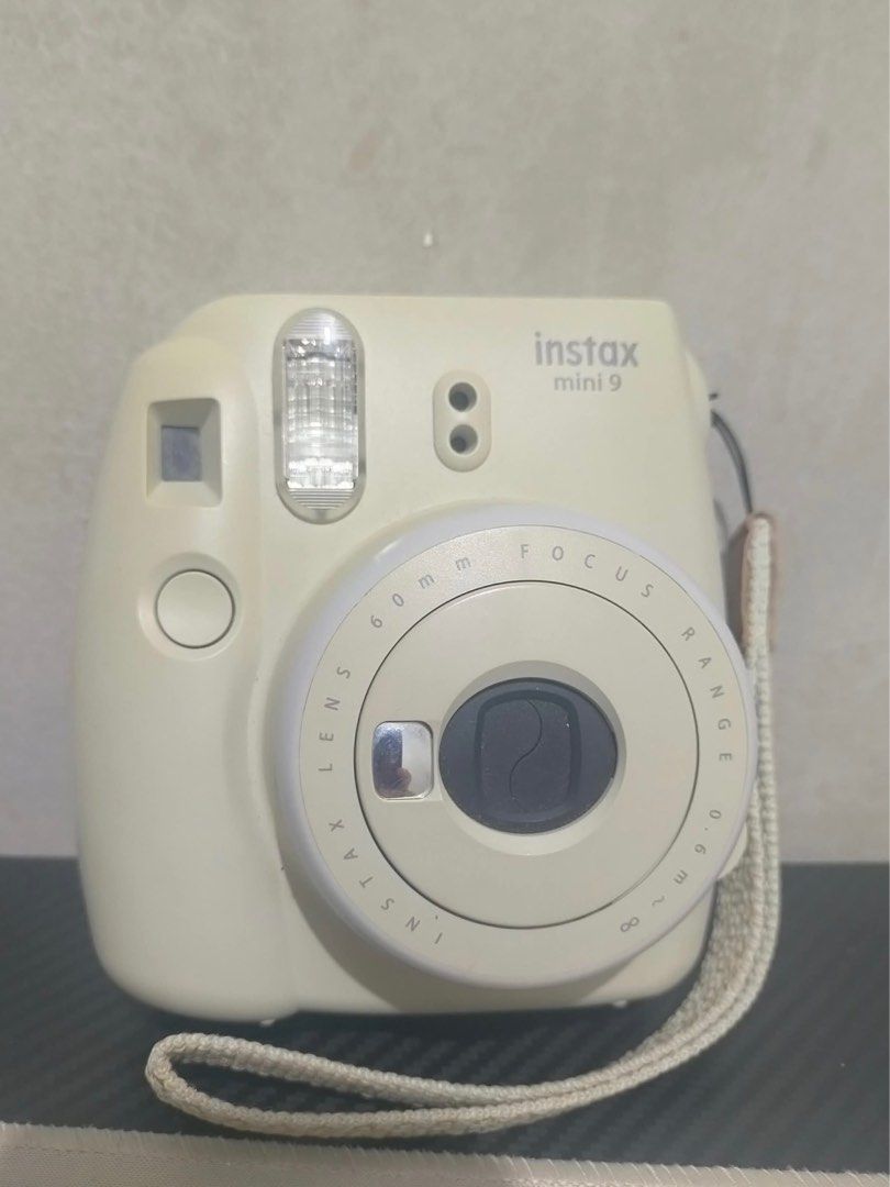 Fujifilm Instax Mini 9 Instant Camera (Category: Cameras) located in Manila. Submitted by brbjuuling (Listing ID 1399609773, Image 1). Description: - Fujifilm Instax Mini 9 instant camera - Built-in flash - 60mm focus lens - Includes wrist strap - Uses Instax Mini film - Features viewfinder and film slot - Fujifilm logo visible -price negotiable! -still in great working condition! .