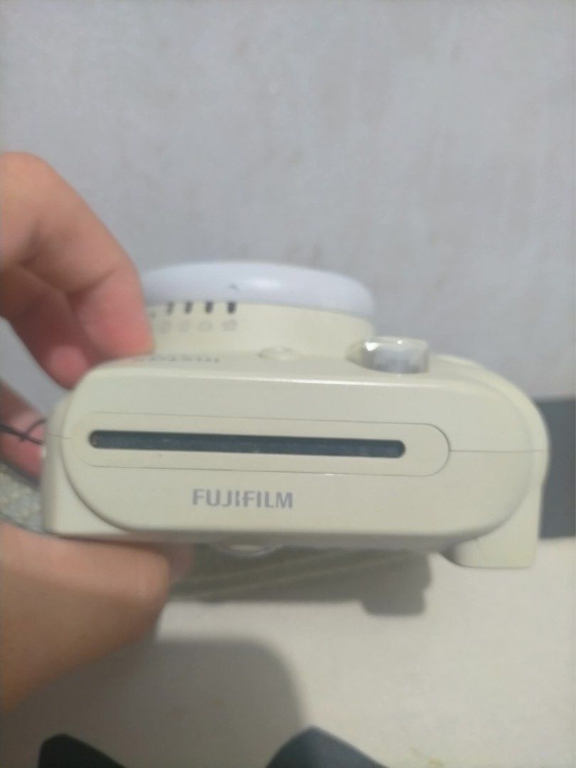 Fujifilm Instax Mini 9 Instant Camera (Category: Cameras) located in Manila. Submitted by brbjuuling (Listing ID 1399609773, Image 3). Description: - Fujifilm Instax Mini 9 instant camera - Built-in flash - 60mm focus lens - Includes wrist strap - Uses Instax Mini film - Features viewfinder and film slot - Fujifilm logo visible -price negotiable! -still in great working condition! .