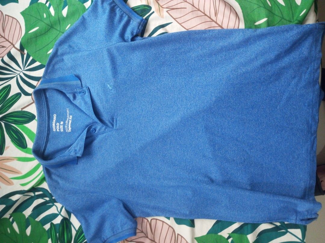Giordano Polo Shirt - Size M (Category: Tshirts & Polo Shirts ) located in Porac. Submitted by themightythrift (Listing ID 1399532369, Image 1). Description: - Giordano polo shirt - Color: Blue - Size: M - Fit: Tapered - Features: Collared neckline, button closure, short sleeves, small chest logo - Material: Lightweight - Ideal for casual wear.