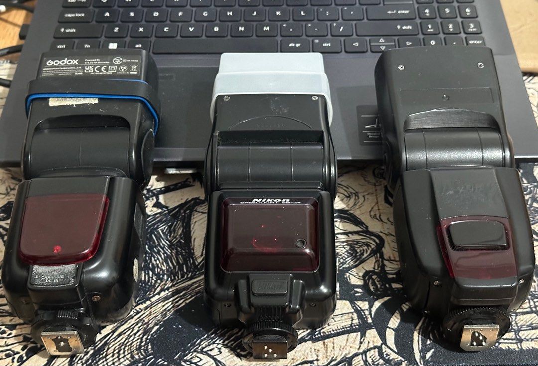 Godox, Nikon, and Yongnuo Camera Flashes (Category: Cameras) located in Malabon City. Submitted by reyyyyyyyyyyyyyyy (Listing ID 1399619450, Image 1). Description: - Includes three camera flashes: Godox, Nikon, and Yongnuo. - All flashes have hot shoe mounts. - Each flash has an LCD screen and setting buttons. For sale Nikon SB-24, Godox TT600 and YN565EX III Nikon SB-24 -Good working condition -Still working -With diffuser -TTL NO ISSUE Godox TT