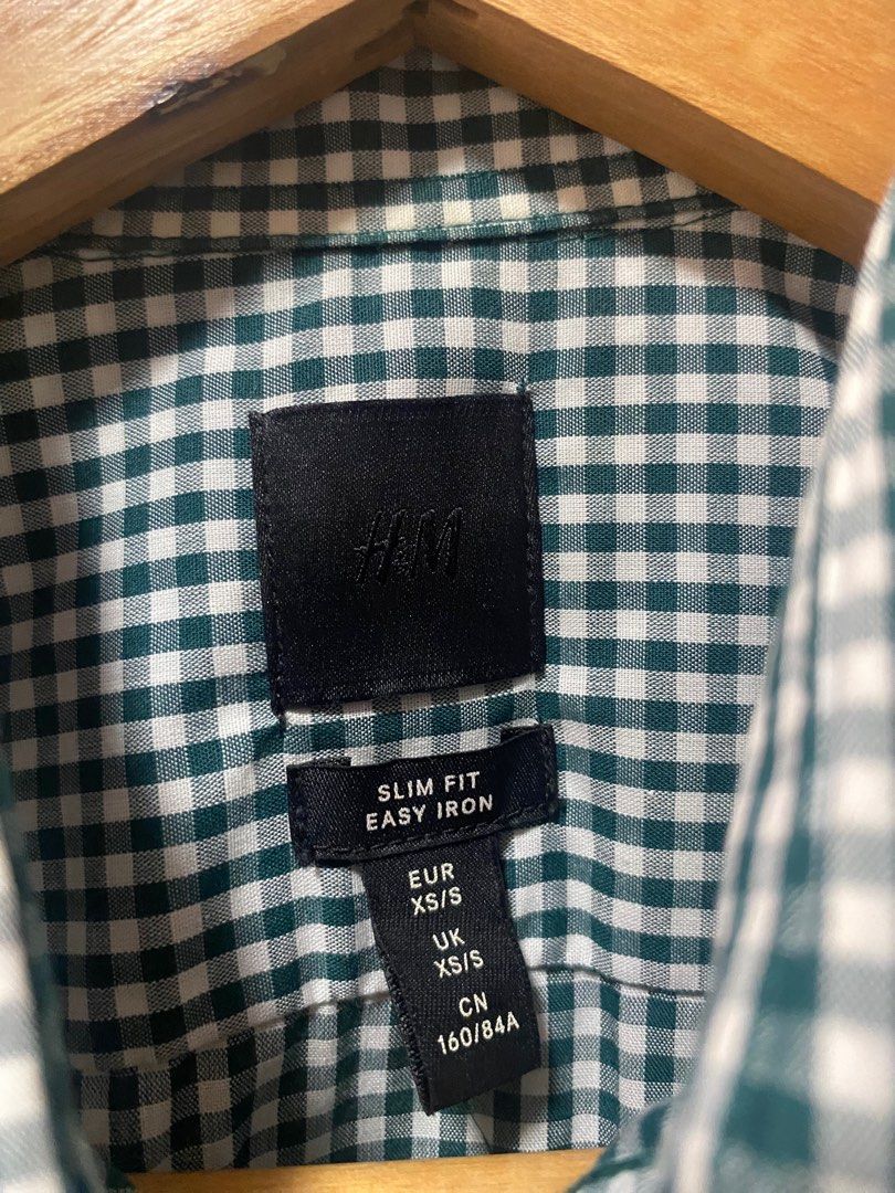 Green Polo - H&M Slim Fit Easy Iron Checkered Shirt (Category: Formal Shirts) located in Pasig City. Submitted by ronmad38148 (Listing ID 1399502125, Image 2). Description: - H&M Slim Fit Shirt - Green and white checkered pattern - Size: XS/S - Easy iron fabric - Button-down front - Long sleeves - Classic collar and buttoned cuffs - Lightweight material - Suitable for casual and semi-formal occasions Color: Green Size: Fits Extra Small - Small Bo