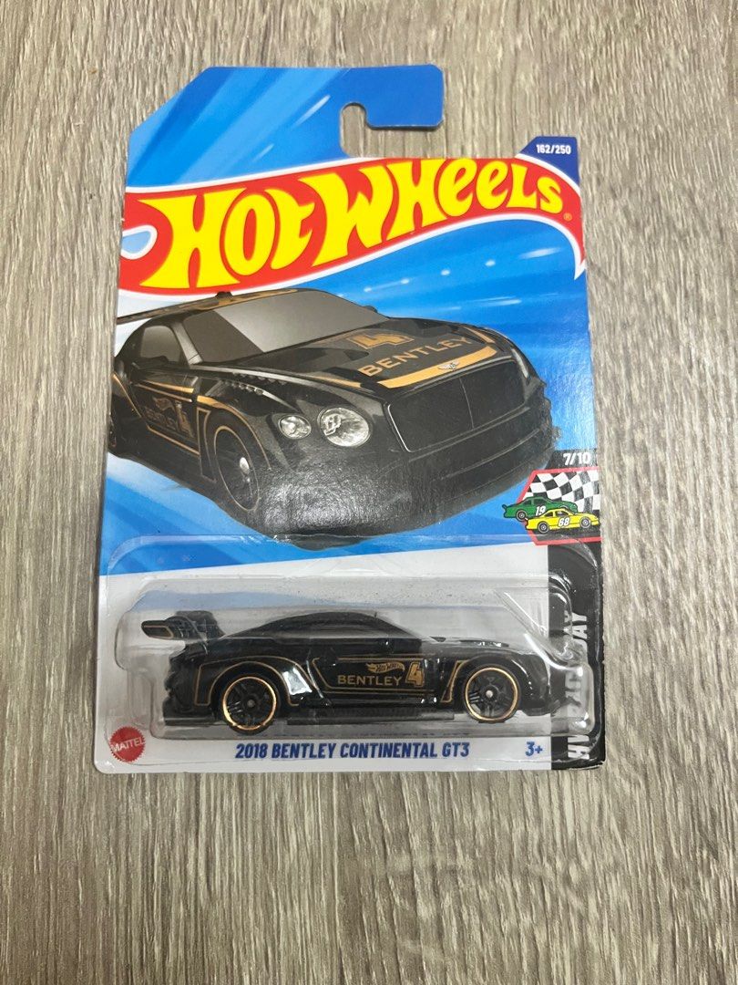 Hot Wheels 2018 Bentley Continental GT3 (Category: Vehicle & Diecast Models) located in Quezon City. Submitted by prclproductions (Listing ID 1399543093, Image 1). Description: - Hot Wheels 2018 Bentley Continental GT3 diecast car. - Part of the HW Race Day series (7/10). - Sleek black color with gold accents. - Features the iconic Bentley logo. - Suitable for ages 3 and up. - Includes original Hot Wheels packaging with model information..