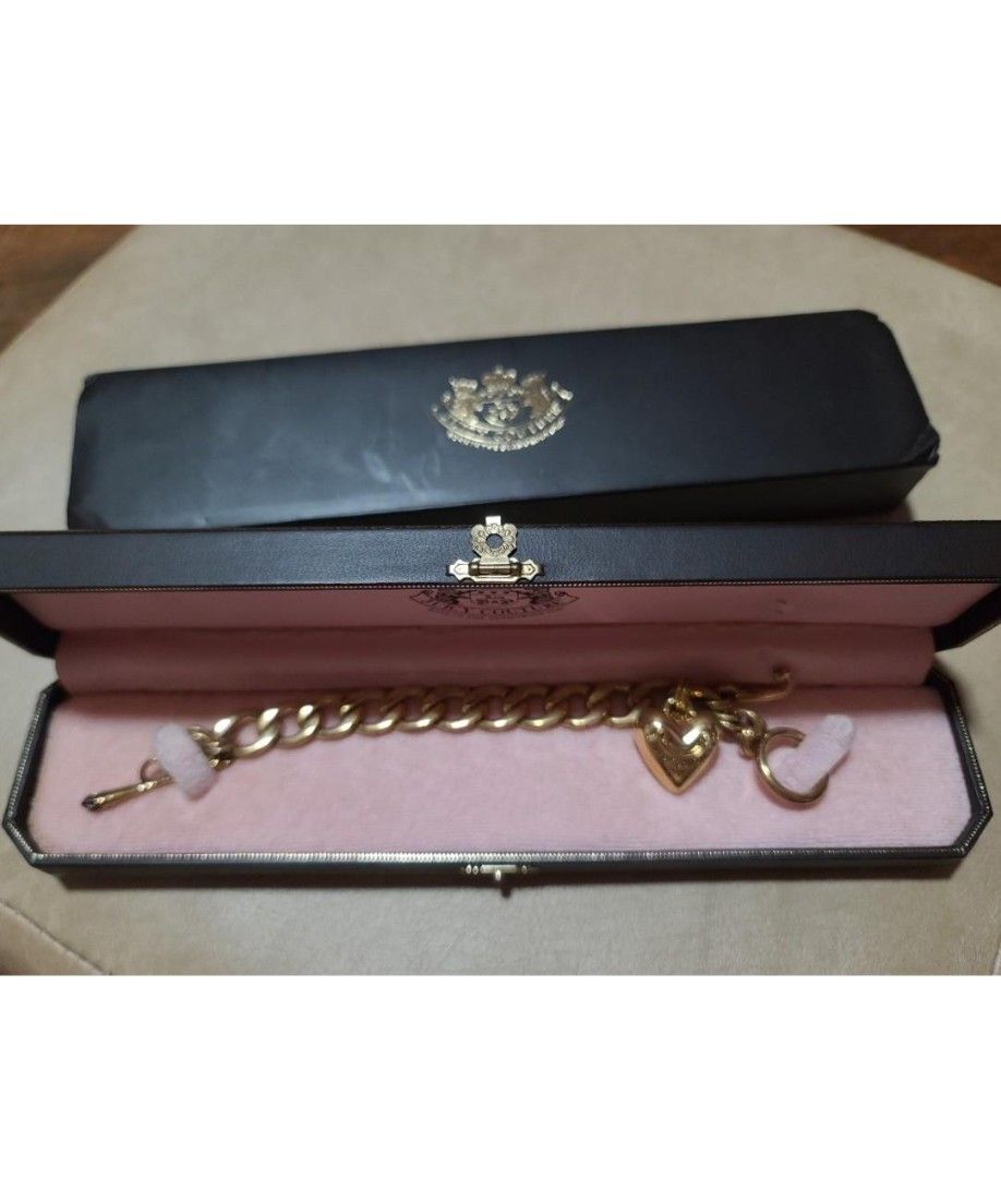 JUICY COUTURE STARTER CHARM BRACELET, GOLD (Category: Bracelets) located in Quezon City. Submitted by stuffiesetc (Listing ID 1399482709, Image 2). Description: JUICY COUTURE STARTER CHARM BRACELET GOLD Guaranteed authentic. used a few times in good condition. minor signs of wear. no rust.in original box ( box has some minor damage on the inside due to storage. bought in the u.s. for about Php10,000. ABOUT THIS ITEM Approximately 7.5" long Gold t