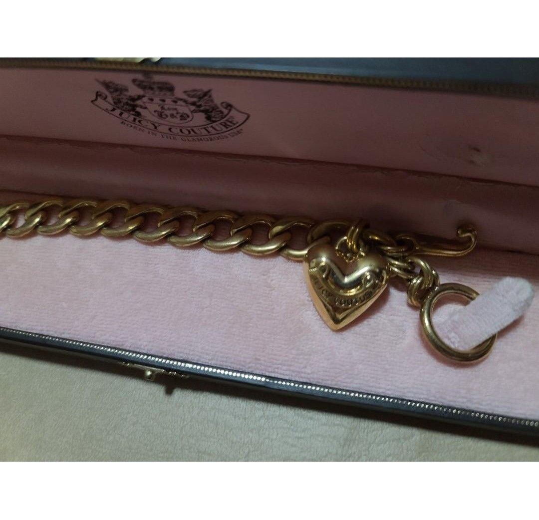 JUICY COUTURE STARTER CHARM BRACELET, GOLD (Category: Bracelets) located in Quezon City. Submitted by stuffiesetc (Listing ID 1399482709, Image 3). Description: JUICY COUTURE STARTER CHARM BRACELET GOLD Guaranteed authentic. used a few times in good condition. minor signs of wear. no rust.in original box ( box has some minor damage on the inside due to storage. bought in the u.s. for about Php10,000. ABOUT THIS ITEM Approximately 7.5" long Gold t