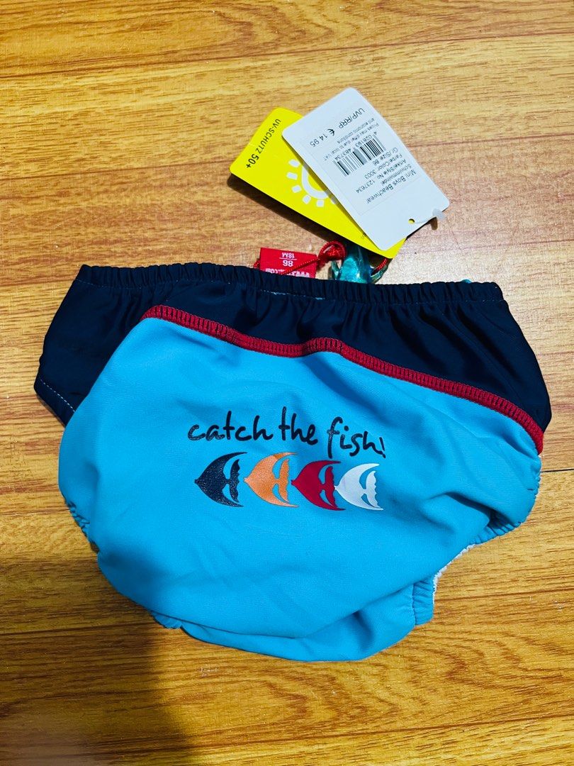 Kanz Swim Diaper (Category: Diapers & Baby Wipes) located in Manila. Submitted by baeshop16 (Listing ID 1399451623, Image 2). Description: - Kanz swim diaper - Light blue with navy blue accents - "Catch the fish" design on the back - UV protection 50+ - Adjustable sides for a secure fit - Brand new with original tag 18m.