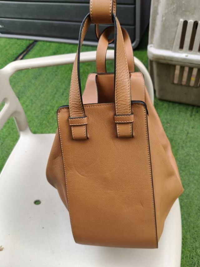 Loewe Hammock Hobo Bag (Category: Luxury Bags & Wallets) located in Muntinlupa City. Submitted by momofsix925 (Listing ID 1399553401, Image 2). Description: - Loewe Hammock Hobo bag - Versatile tan color - Unique design with zip closure - Multiple carrying options (shoulder or top handles) - Spacious interior - Suitable for everyday use - Functional and fashionable.