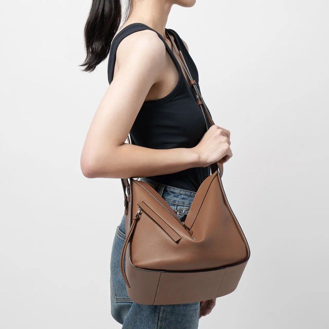 Loewe Hammock Hobo Bag (Category: Luxury Bags & Wallets) located in Muntinlupa City. Submitted by momofsix925 (Listing ID 1399553401, Image 3). Description: - Loewe Hammock Hobo bag - Versatile tan color - Unique design with zip closure - Multiple carrying options (shoulder or top handles) - Spacious interior - Suitable for everyday use - Functional and fashionable.