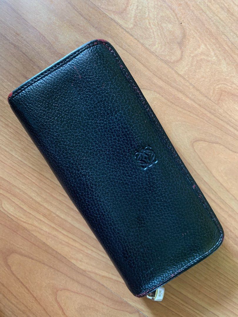 Loewe wallet (Category: Luxury Bags & Wallets) located in Las Pinas. Submitted by yolk.ph (Listing ID 1399537010, Image 1). Description: Loewe long wallet 100% authentic from japan Flaw: orig color showing up (recolored); broken zipper Can just be used as project wallet Can give this as a freebie when u purchase one luxury wallet or bag.
