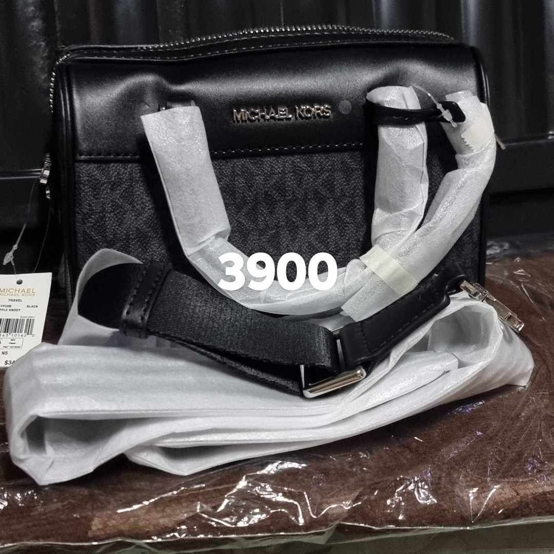 Michael Kors Black Crossbody Bag (Category: Luxury Bags & Wallets) located in Subic. Submitted by winlar (Listing ID 1399564298, Image 1). Description: - Brand new Michael Kors crossbody bag - Color: Black - Features a secure zip closure - Includes a stylish black strap - Showcases the signature Michael Kors logo - Comes with original packaging - Price: ₱3900.