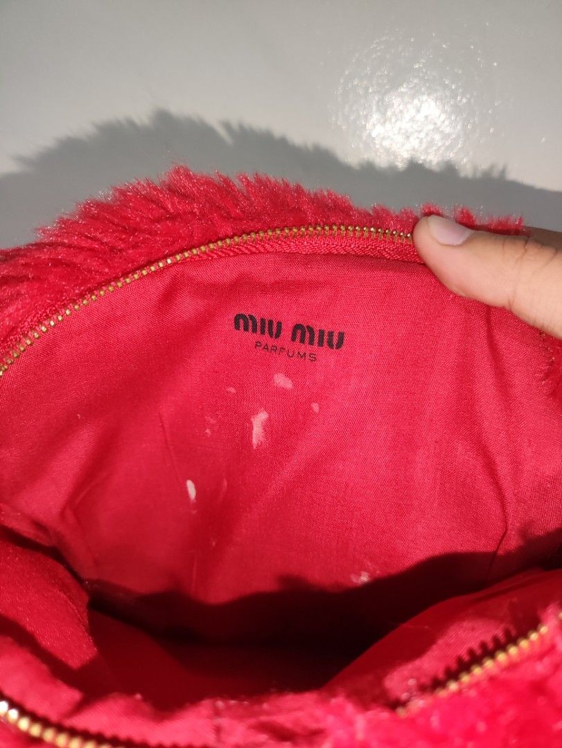 MIU MIU POUCH (Category: Luxury Bags & Wallets) located in Romblon. Submitted by teppthrift. (Listing ID 1399544952, Image 3). Description: MIU MIU POUCH ISSUE NASA PIC VERY GOOD CONDITION.