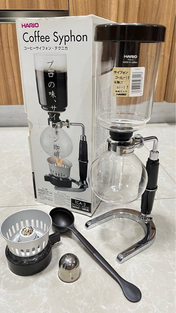 Original Hario Coffee Syphon TCA-3 (Category: Coffee Machines & Makers) located in Pasig City. Submitted by ktnlm (Listing ID 1399598802, Image 2). Description: Hario Coffee Syphon coffee maker (with box) TCA-3 with parts Missing filter only, other parts complete and working Works properly, lightly used RFS: Excess item MOP: BPI/BDO/GCash Shipping fee c/o buyer.
