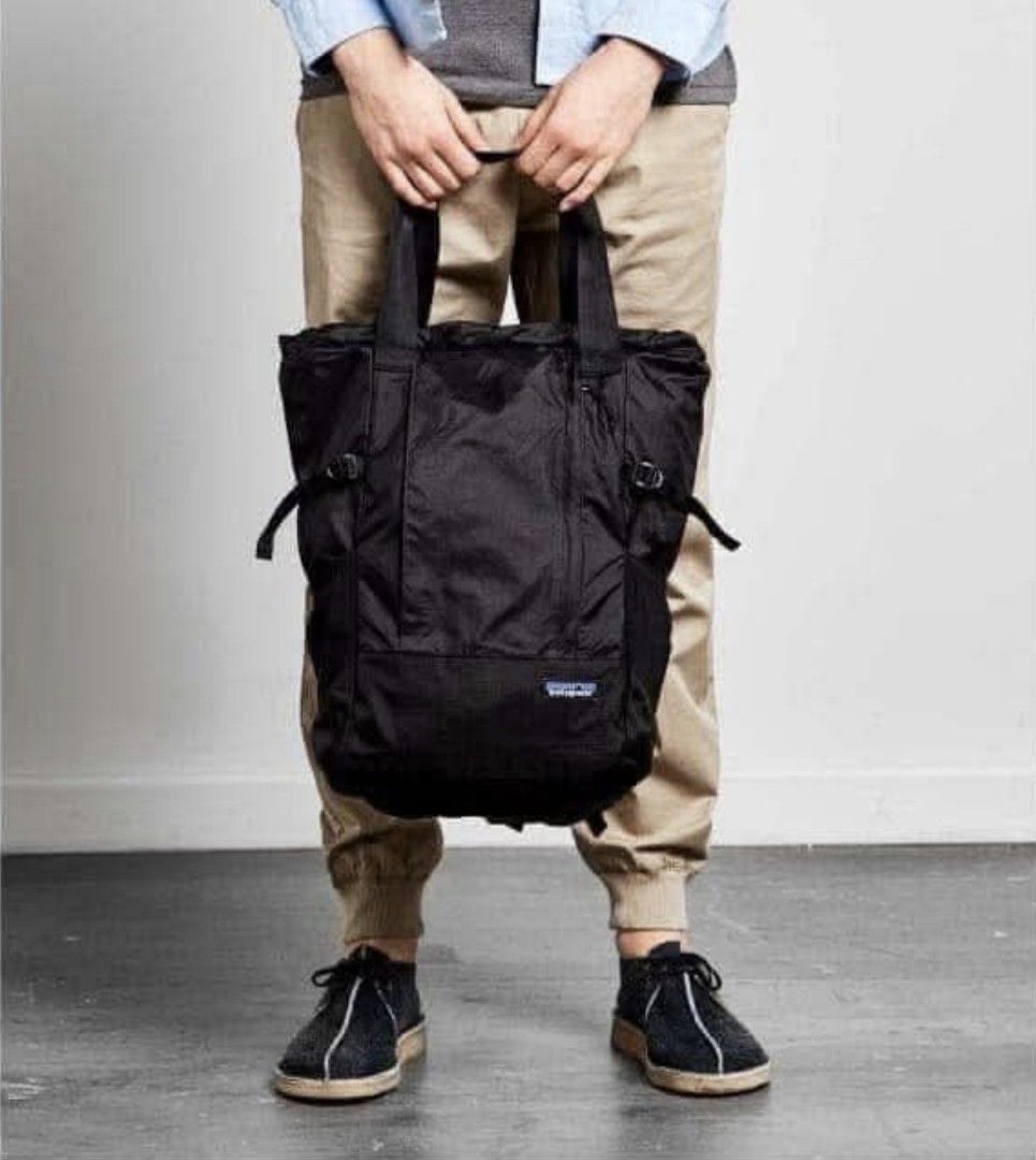 Patagonia Black Convertible Tote Pack (Category: Backpacks) located in Makati City. Submitted by kaecee. (Listing ID 1399503013, Image 1). Description: - Patagonia Tote Pack - Converts from tote to backpack - Black exterior - Multiple compartments - Adjustable straps - Patagonia logo patch - Durable and lightweight material - Top handles and backpack straps for carrying options.