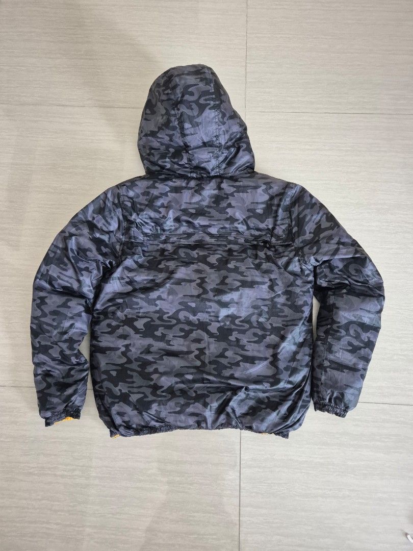 Winter down jacket, reversible (Category: Coats, Jackets and Outerwear) located in Singapore. Submitted by instadeals (Listing ID 1399531849, Image 2). Description: Winter down jacket Good condition, lightly used Reversible design: camo print / yellow With non detachable hood Two side pockets Measurements in images Length 70cm Pit to pit 60cm.