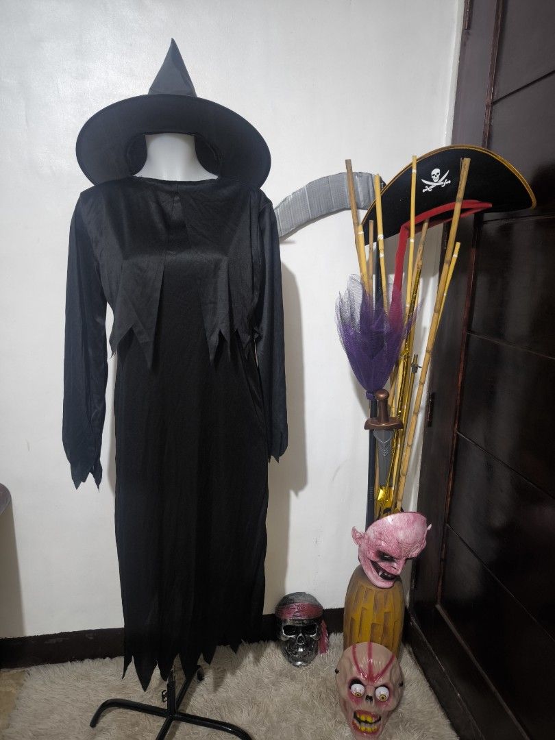 Witch Costume with Hat (Category: Sets or Coordinates) located in Marikina City. Submitted by alecfordy (Listing ID 1399632649, Image 2). Description: - Black witch costume - Includes dress and matching hat - Dress features: - Long sleeves - Jagged hemline - Shoulder width: 16 inches - Width: 20 inches - Length: 45 inches - Perfect for Halloween or costume parties.