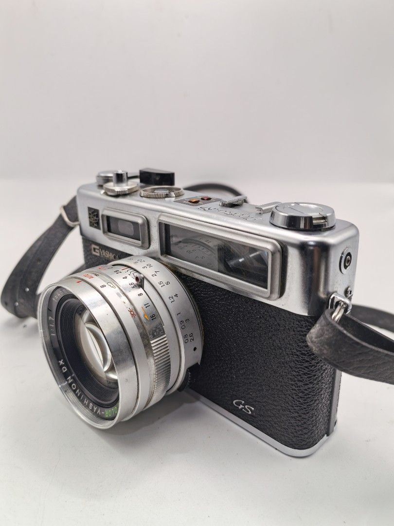 Yashica Electro 35 GS (Category: Cameras) located in Cebu City. Submitted by dudes_villanueva (Listing ID 1399455825, Image 2). Description: Yashica Electro 35 GS Note: Tested Functional. All sales final and non-refundable. Battery not included for testing and demo only. Condition: Working Shutter Blade, Aperture and Speed Dial. Working Film Lever. Timer Functional. Clean Lens. Viewfinder may require a bit of cleaning due to dust but still good. 