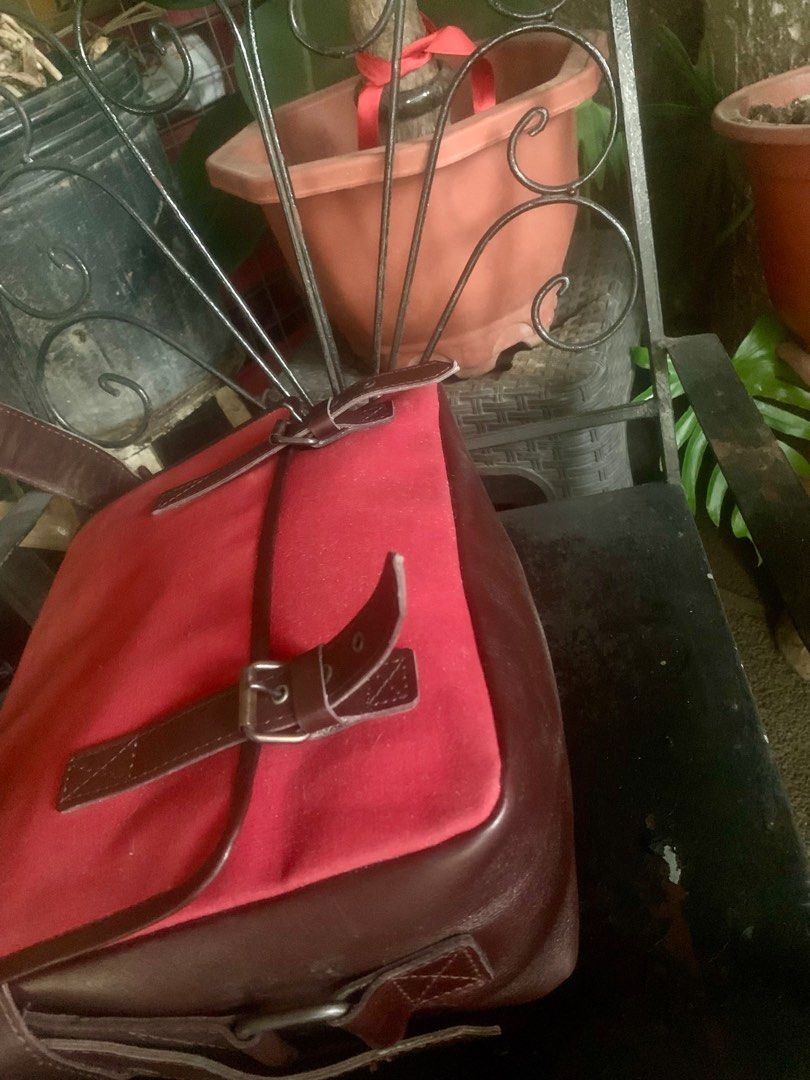 YSL Red Shoulder Bag (Category: Luxury Bags & Wallets) located in General Santos City (Dadiangas). Submitted by mj_luxuries_bags_and_stuff (Listing ID 1399553338, Image 3). Description: - Authentic YSL shoulder bag from Japan Surplus - Color: Red and Brown - Features a flap closure with buckle details - Interior: Red with zipper closure - Includes YSL tag - Long shoulder strap - Zipper with YKK logo.