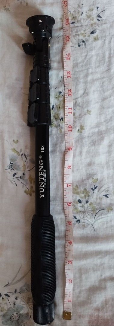 Yunteng 188 Monopod (Category: Tripods & Monopods) located in Makati City. Submitted by chamarket.2022 (Listing ID 1399526032, Image 1). Description: - Yunteng 188 Monopod - Color: Black - Extendable design - Extends to approximately 48 inches - Features a comfortable handle - Adjustable sections for desired height - Includes a screw mount head for easy camera attachment.