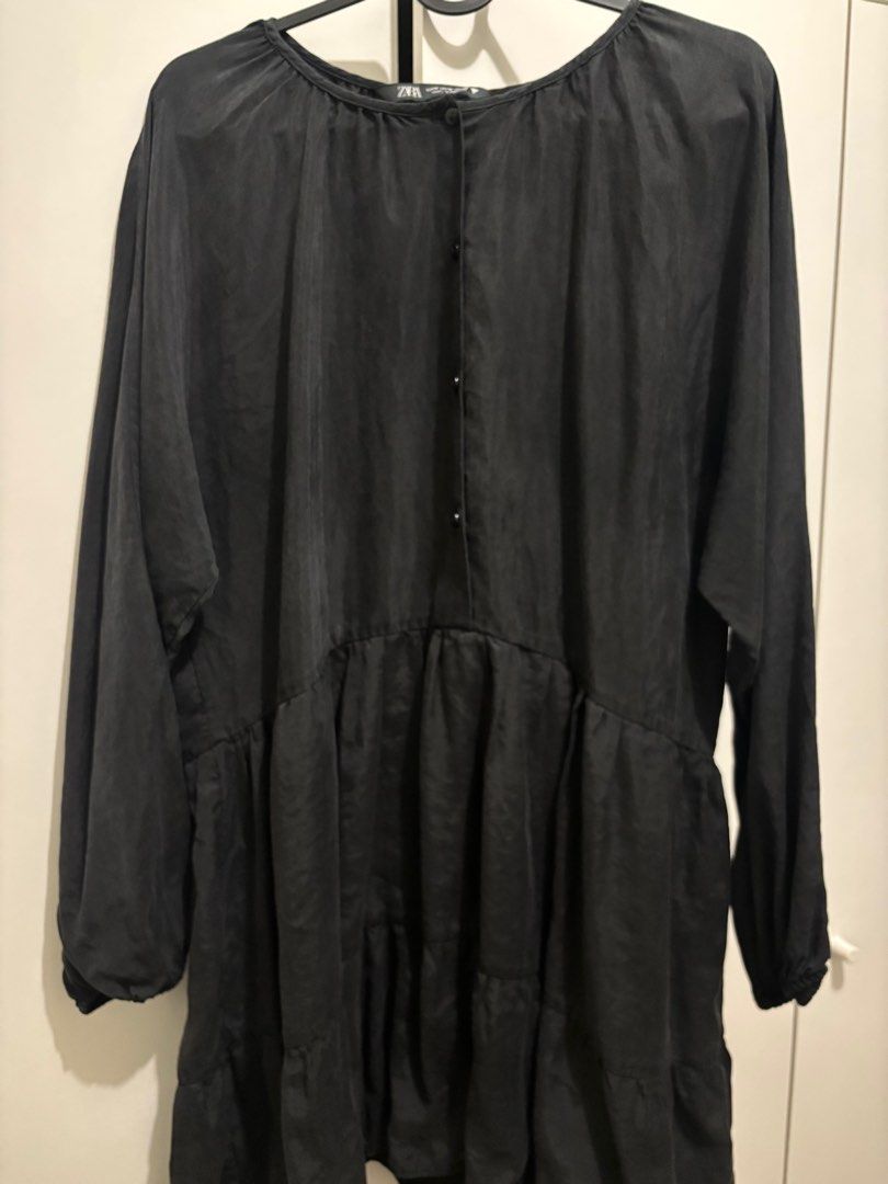 Zara Black Tiered Mini Dress (Category: Dresses) located in Pasig City. Submitted by kathB (Listing ID 1399533881, Image 2). Description: ZARA black mini dress • Tiered design • Long sleeves • Round neckline • Button details • Relaxed fit • Lightweight fabric • Size M I usually wear an XL, but this fits me nicely — just a bit short on me (I’m 5’4”). Super comfy and easy to style for casual or dressy looks!.
