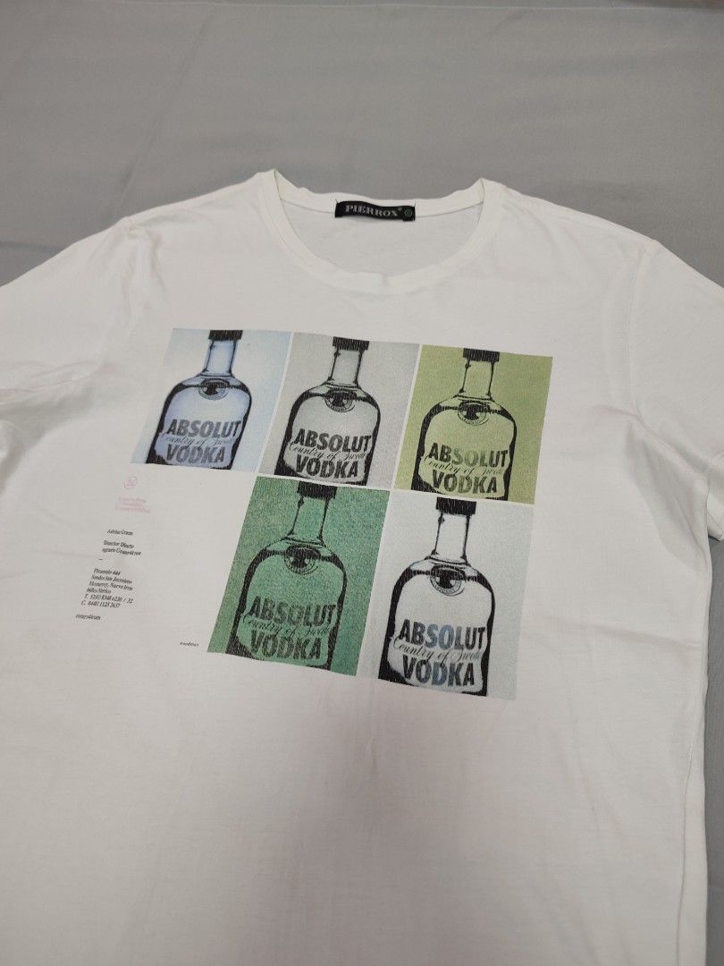 Absolut Vodka Graphic T-shirt (Category: Shirts) located in Dasmarinas. Submitted by sbtt_ (Listing ID 1399701268, Image 1). Description: - Absolut Vodka graphic t-shirt - Features a pop art style print - Design includes Absolut Vodka bottles - Crew neck and short sleeves - Brand name visible.