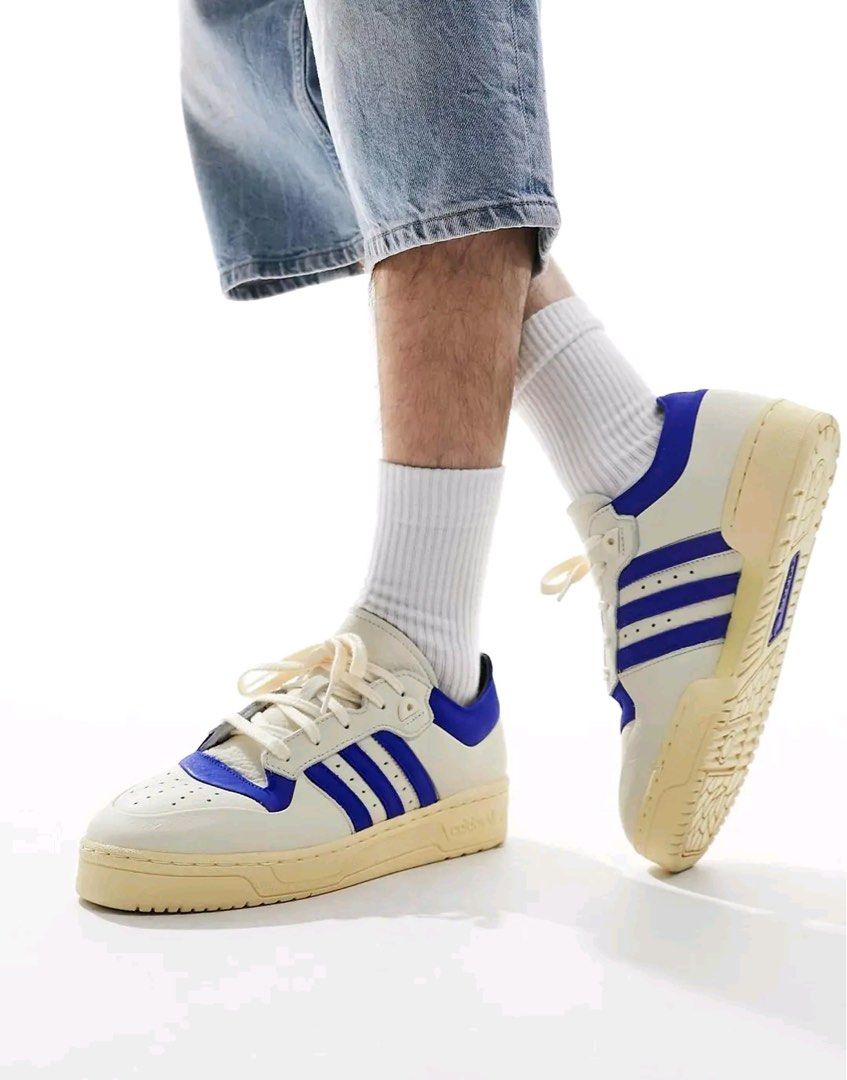 Adidas Rivalry 86 Low 002 Sneakers (Category: Sneakers) located in Caloocan City. Submitted by raffaellosanzio (Listing ID 1399678486, Image 2). Description: - Adidas Rivalry 86 Low sneakers - Color: Cream and Blue - Features the iconic Adidas three stripes - Size: US 10, UK 9.5, EUR 44, 280 CM - Comes with original tags and box - Original Price: PHP 5,800.00.