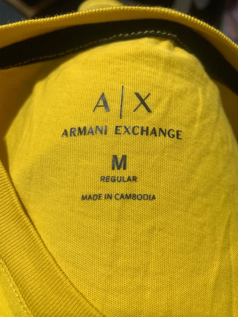 Armani Exchange AX Yellow T-shirt - Medium (Category: Tshirts & Polo Shirts ) located in Caloocan City. Submitted by pepperfinds (Listing ID 1399828328, Image 2). Description: - Armani Exchange AX t-shirt - Yellow color - Size: Medium - Features AX logo and Armani Exchange branding - Made in Cambodia - Graphic design on front - Crew neck - Short sleeves - Black stripe on back of neck - Soft Cotton - Dimes: 20.5 x 28 - Color Rate: 9/10 - Good Cond