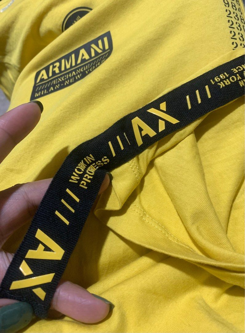 Armani Exchange AX Yellow T-shirt - Medium (Category: Tshirts & Polo Shirts ) located in Caloocan City. Submitted by pepperfinds (Listing ID 1399828328, Image 3). Description: - Armani Exchange AX t-shirt - Yellow color - Size: Medium - Features AX logo and Armani Exchange branding - Made in Cambodia - Graphic design on front - Crew neck - Short sleeves - Black stripe on back of neck - Soft Cotton - Dimes: 20.5 x 28 - Color Rate: 9/10 - Good Cond