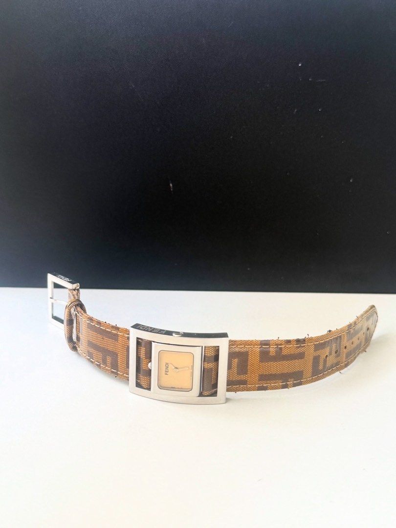 Authentic preowned Fendi Reversible FF rectangle watch (Category: Luxury Watches) located in San Pablo. Submitted by misskittyph (Listing ID 1399680059, Image 3). Description: Fendi Reversible FF rectangle watch . 🏷 P12k only Two looks in one iconic design — this reversible timepiece transitions effortlessly from watch to statement accessory. Featuring the iconic Zucca canvas strap . 8.5/10 condition With tolerable hairlines Generic watchbox Lay
