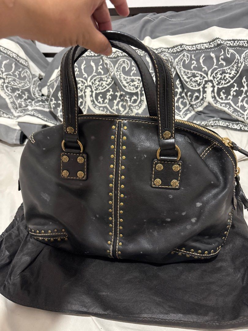 Black Leather Handbag with Studs (Category: Luxury Bags & Wallets) located in Las Pinas. Submitted by ochey20 (Listing ID 1399754180, Image 2). Description: - Authentic Original Michael kors hand /shoulder bag -Black leather handbag - Gold-colored studs and stitching - Double handles - Zip closure - Light-colored interior lining - Interior zip pocket - Includes dust bag - Minor white spots on exterior - it’s just so dirty needs to be clean .