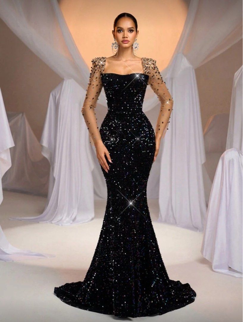 Black Sequin Evening Gown with Sheer Sleeves (Category: Evening dresses & gowns) located in Taguig. Submitted by declutteringann (Listing ID 1399780587, Image 1). Description: - Elegant black sequin evening gown - Features a square neckline - Sheer sleeves with embellishments - Mermaid silhouette - Low back design - Floor-length - Ideal for formal events and special occasions.