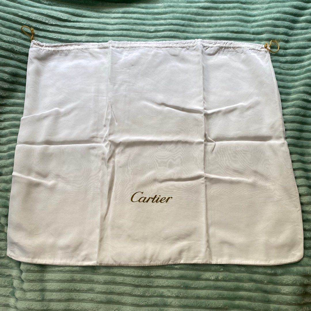 Cartier Dust Bag (Category: Luxury Bags & Wallets) located in Iligan City. Submitted by authenticdustbags.ph (Listing ID 1399656288, Image 2). Description: - Authentic Cartier dust bag - Features the Cartier logo in gold - White color - Drawstring closure - Perfect for protecting luxury items size 22 width x 17.5 inches height.