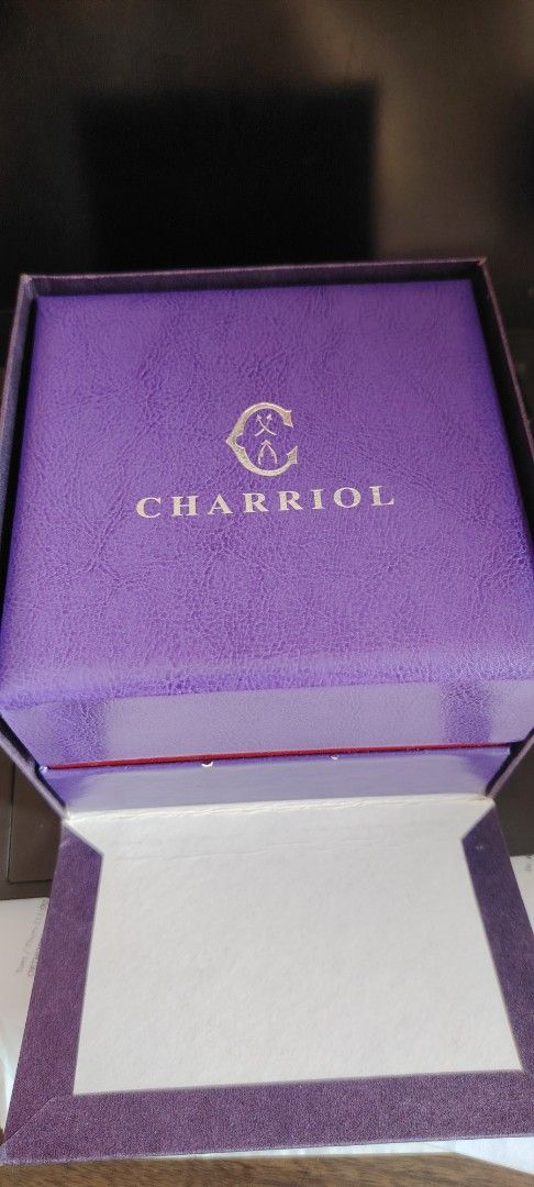 Charriol St. Tropez Watch (Category: Women's Watches) located in Mandaluyong City. Submitted by trisha_001 (Listing ID 1399649349, Image 3). Description: - Charriol St. Tropez watch - Gold-tone bezel with diamond-like embellishment - Silver and gold cable strap - Includes original box and papers - Comes with a velvet pouch - Mother-of-pearl watch face - Visible Charriol logo on the back.