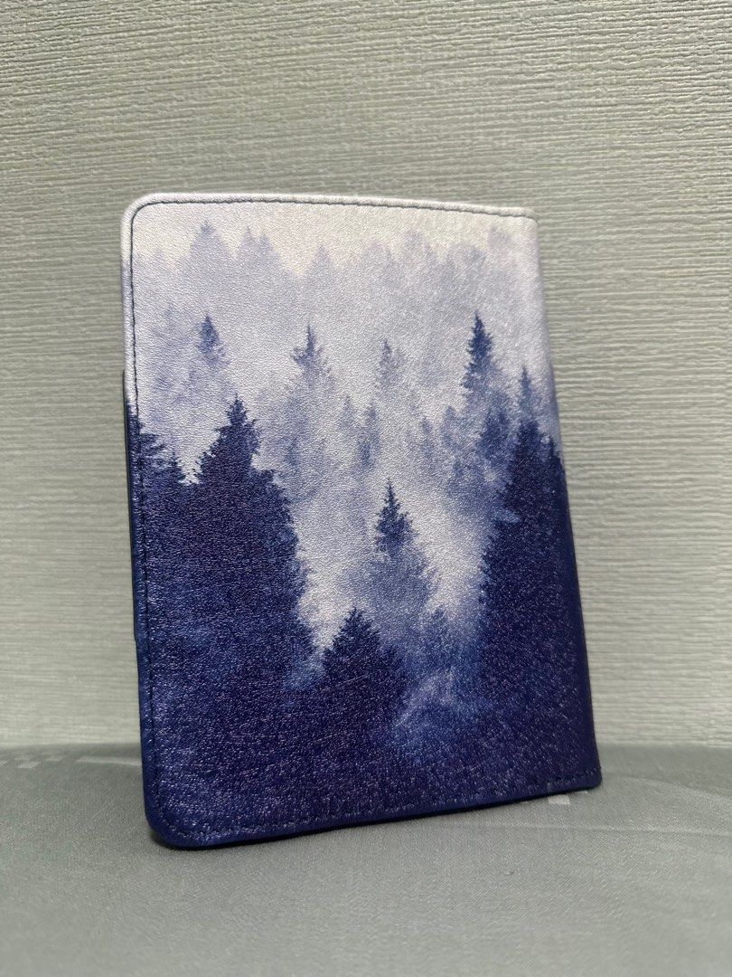 Forest Print E-Reader Case (Category: Cases & Sleeves) located in Singapore. Submitted by HelpMeKonMariPls (Listing ID 1399769248, Image 1). Description: Dimensions: Fits 10cm (width) x14cm (height). Suitable for 6 inch e-reader (confirm your own e-reader dimensions first). - Forest print tablet case - Secure closure - Interior pockets for cards/small items - Stylish and practical - PU Leather Material Selling because bought wrong size.