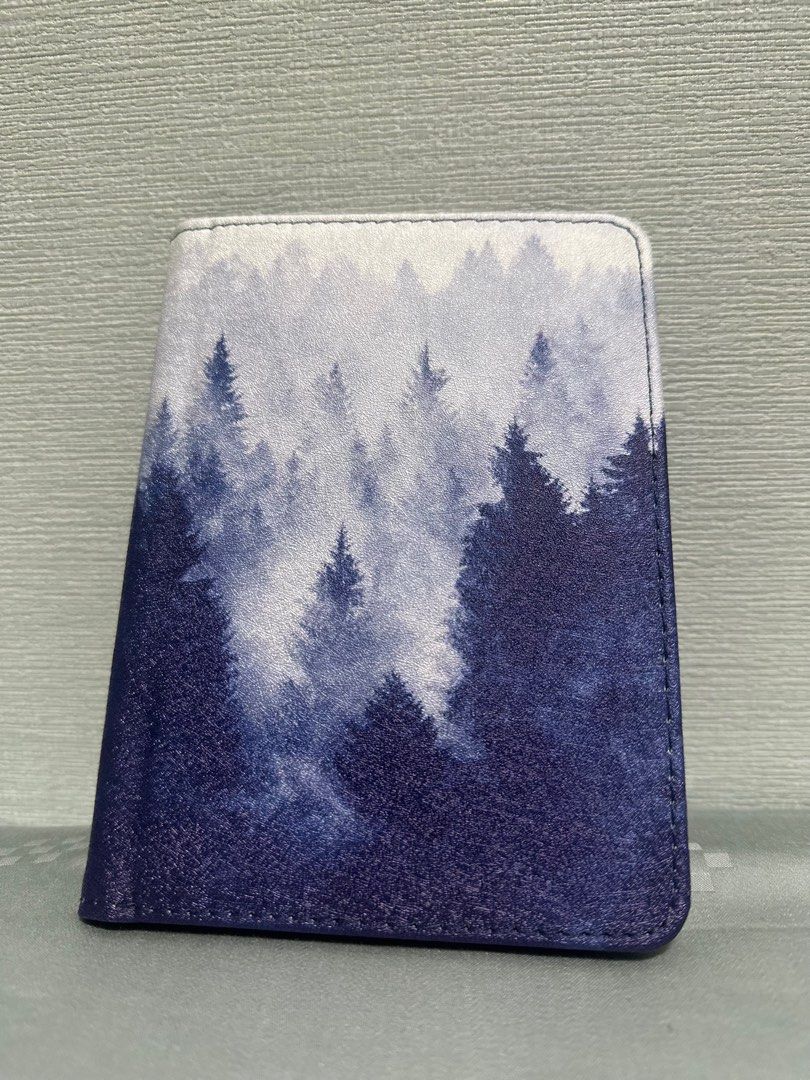 Forest Print E-Reader Case (Category: Cases & Sleeves) located in Singapore. Submitted by HelpMeKonMariPls (Listing ID 1399769248, Image 3). Description: Dimensions: Fits 10cm (width) x14cm (height). Suitable for 6 inch e-reader (confirm your own e-reader dimensions first). - Forest print tablet case - Secure closure - Interior pockets for cards/small items - Stylish and practical - PU Leather Material Selling because bought wrong size.