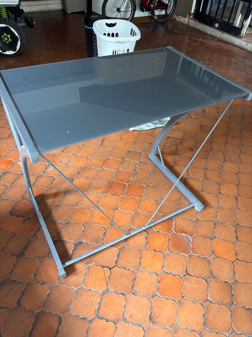 Glass Top Computer Table (Category: Tables & Sets) located in Las Pinas. Submitted by jynnette (Listing ID 1399690588, Image 3). Description: - Sleek glass top - Sturdy metal frame - Rectangular shape - Gray color - Suitable for computer or study use.