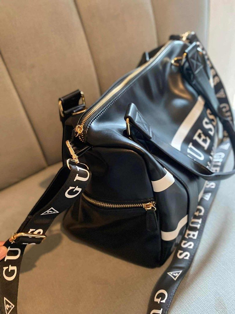 Guess travel bag (Category: Luxury Bags & Wallets) located in San Fernando. Submitted by smjhsmnlzcn (Listing ID 1399673894, Image 2). Description: Guess travel bag with sling strap.