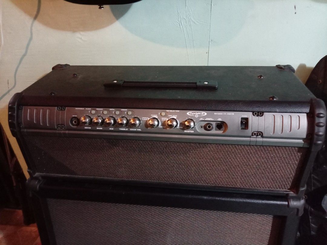 Line 6 Spider III HD75 Guitar Amplifier (Category: Musical Instruments) located in Agdangan. Submitted by hairulmusicalcolection (Listing ID 1399705799, Image 2). Description: - Line 6 Spider III HD75 guitar amplifier - Two-piece stack (head and speaker cabinet) - Effects: phaser, chorus/flange, sweep echo, tap delay - Controls: master volume, tap delay time - Headphone/record out jack - Speaker cabinet with Line 6 logo.
